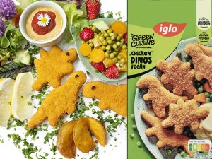 Colorful vegan snack platter with dinosaur-shaped nuggets, greens, lemon, and a green Iglo Green Cuisine package.