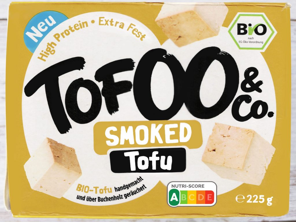 Tofoo & Co | Smoked Tofu | Herzschatz Front of smoked tofu packaging: large 'Tofu' text, 'Smoked' label, BIO badge and German branding on yellow box