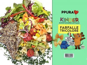 Colorful pasta salad on the left with bow-tie pasta, corn, tomatoes, and greens; right side shows bright green packaging with cartoon animals and text.