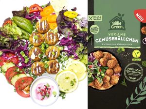 Colorful vegan platter with falafel bites, greens, tomatoes, lemon wedges, and a pink dip beside Billie Green vegan packaging.